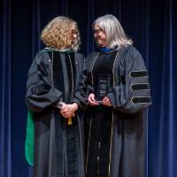 Provost shaking hands with a recipient